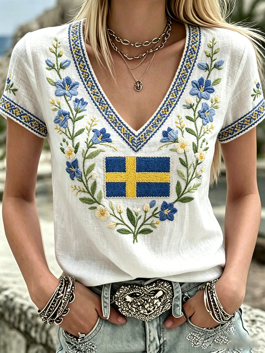 Women's black t-shirt with Swedish text about plants and flowers, V-neck, relaxed style