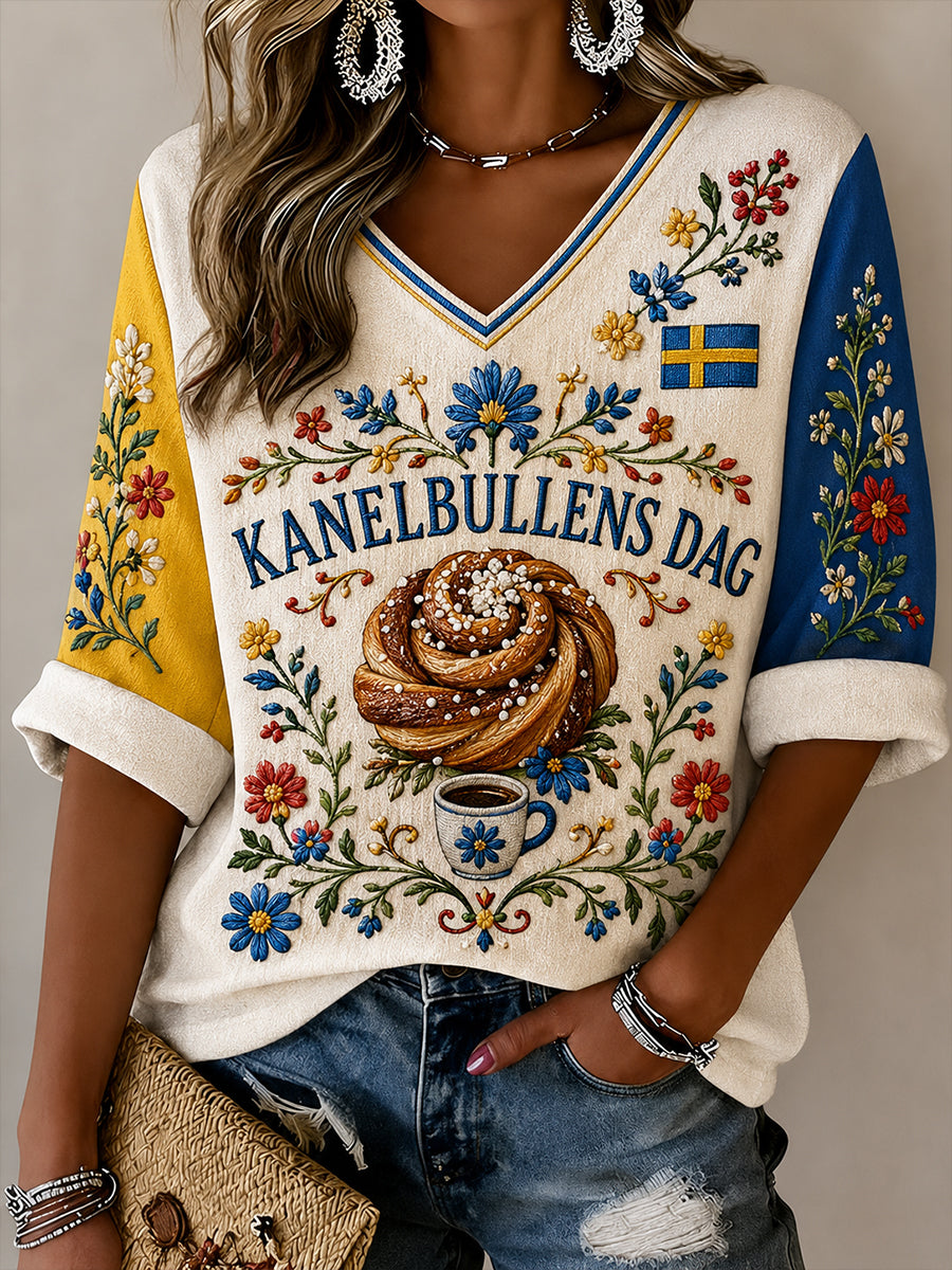 Dammössa Sverige Kanelbullens Dag-mönstrad linneskjorta med v-ringning
