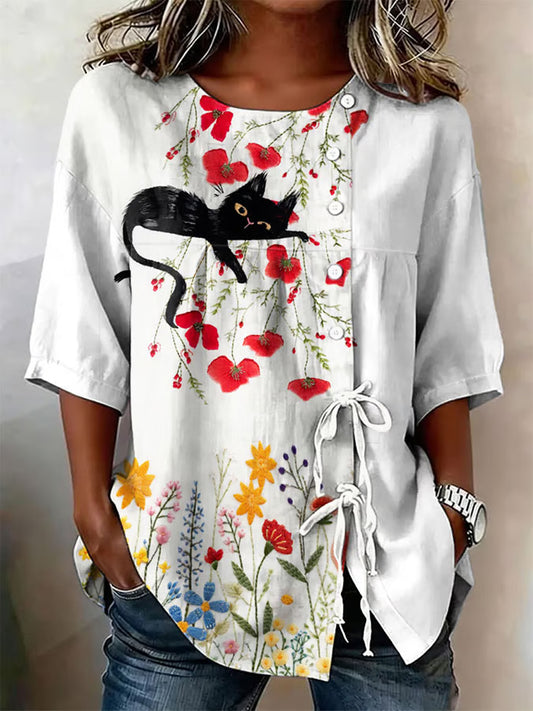 Dams topp i bomull med katt- och blommönster samt snörning