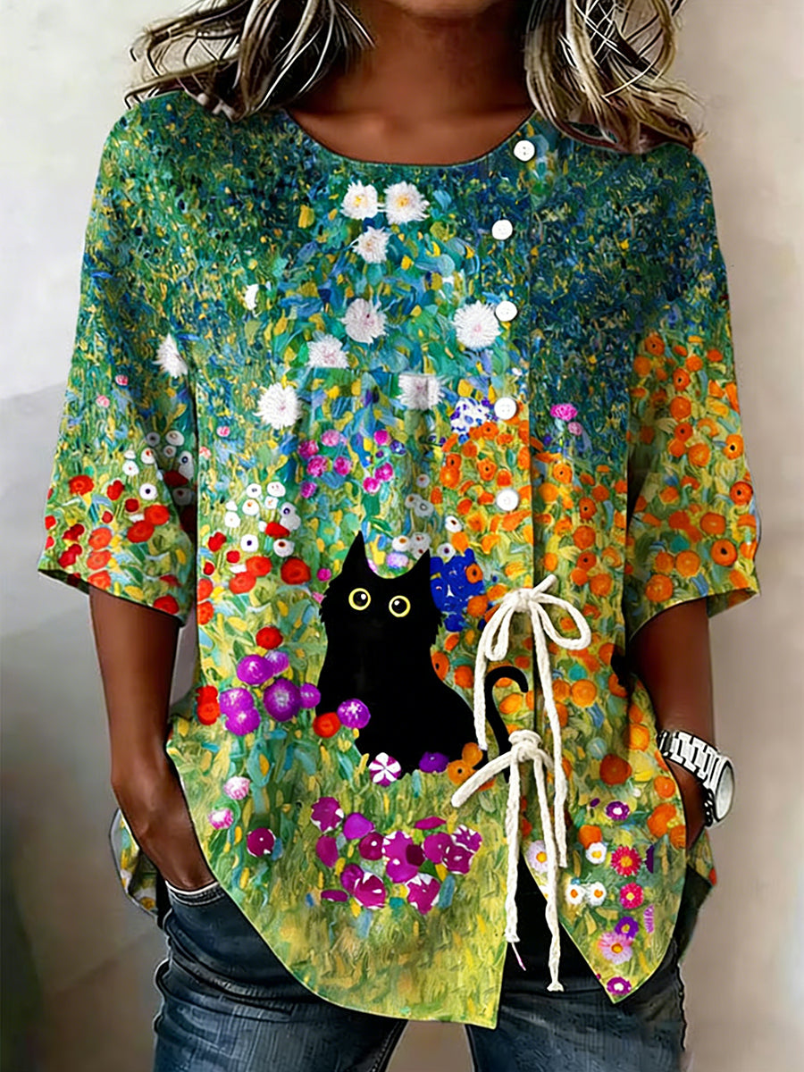Dams topp i bomull med katt- och blommönster samt snörning