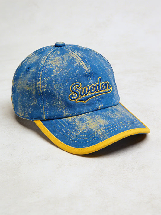 Adorned hat with colour-blocked print