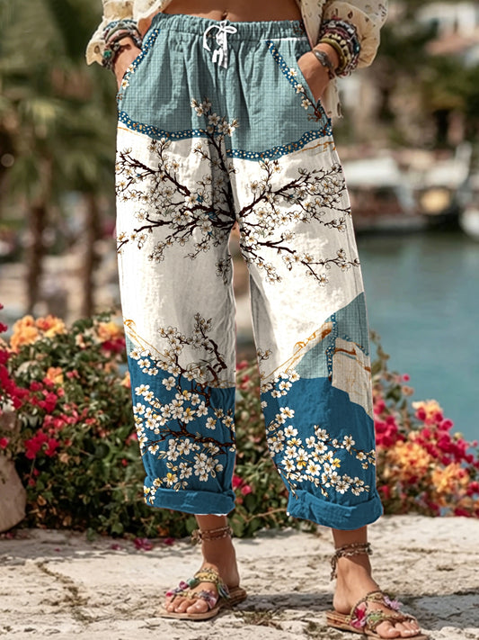 Women's long linen blend leisure trousers with a floral pattern