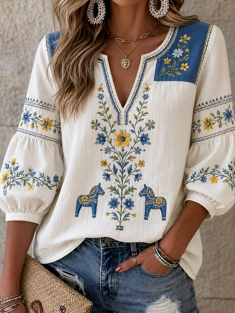Women's vintage Swedish style blouse with embroidered floral pattern, midsummer art print and a relaxed cotton-linen fit