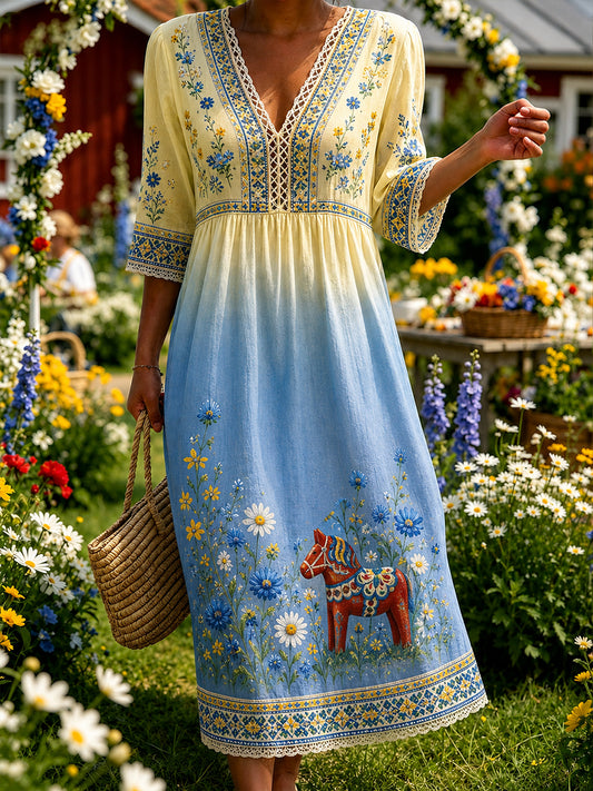 Dammens midsommarklänning med blommönster och v-ringning