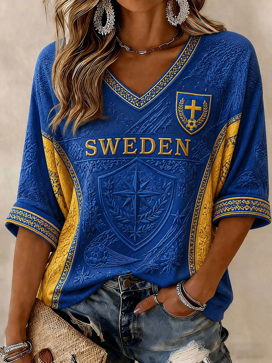 Damtröja i svensk fotbollsstil med tryckt mönster, halvlånga ärmar och v-ringning