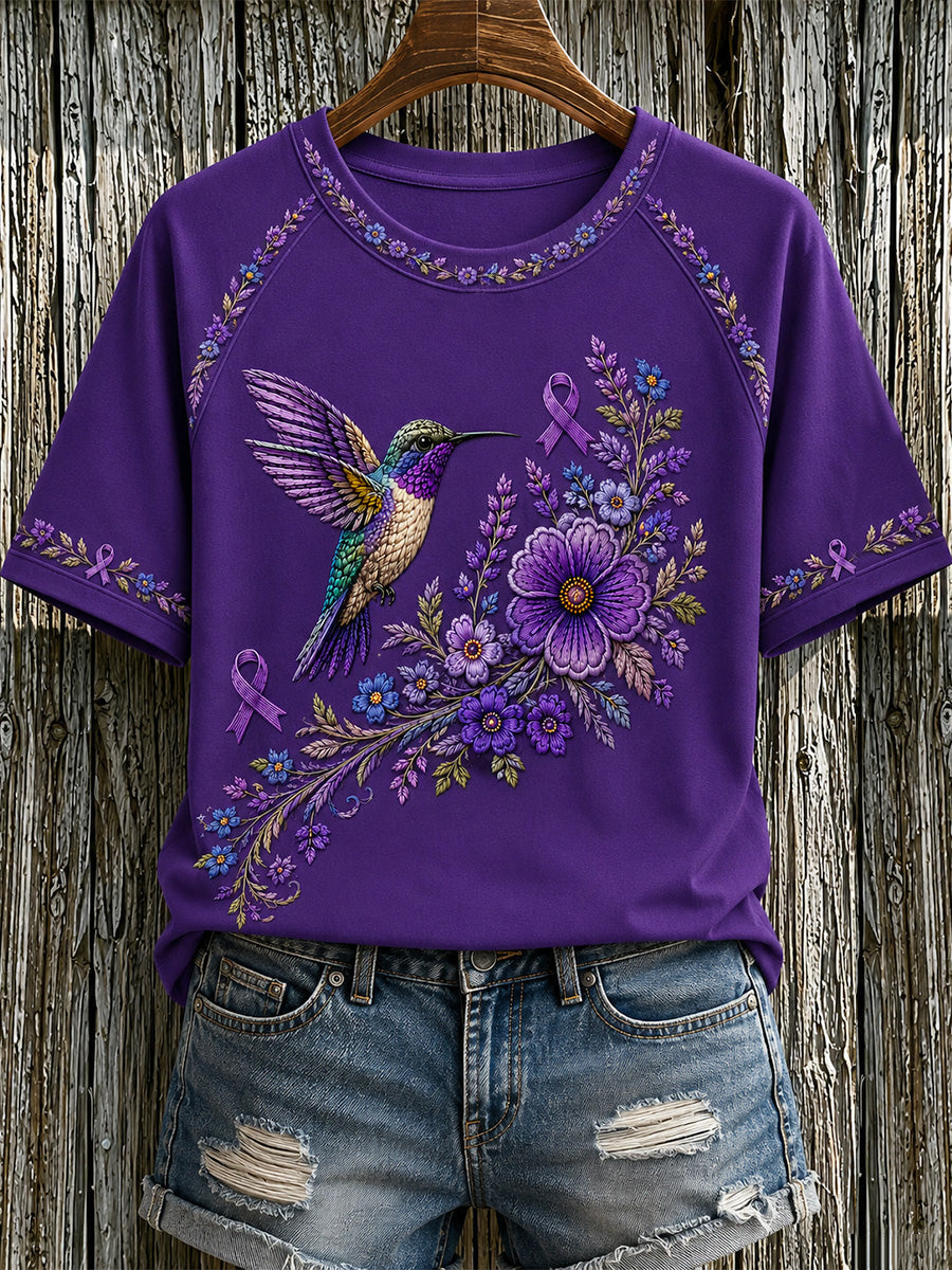 T-shirt för Alzheimers-medvetande med lila blommönster och kolibri, till stöd för drabbade kvinnor