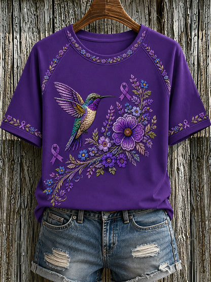 T-shirt för Alzheimers-medvetande med lila blommönster och kolibri, till stöd för drabbade kvinnor