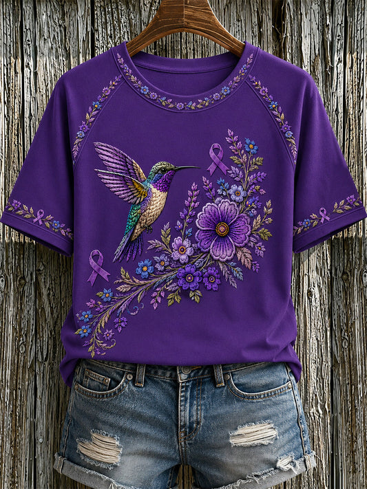 T-shirt för Alzheimers-medvetande med lila blommönster och kolibri, till stöd för drabbade kvinnor