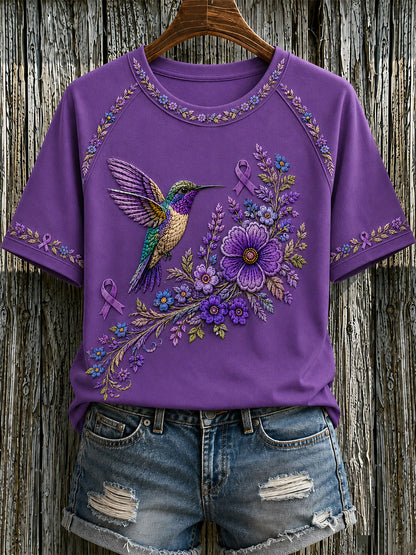 T-shirt för Alzheimers-medvetande med lila blommönster och kolibri, till stöd för drabbade kvinnor