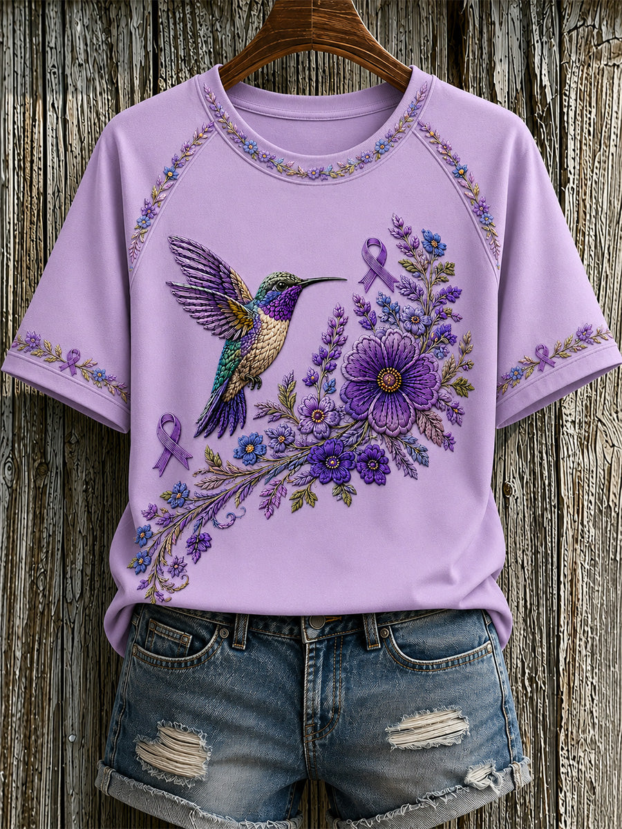 T-shirt för Alzheimers-medvetande med lila blommönster och kolibri, till stöd för drabbade kvinnor
