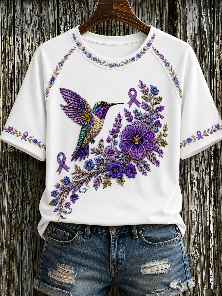 T-shirt för Alzheimers-medvetande med lila blommönster och kolibri, till stöd för drabbade kvinnor