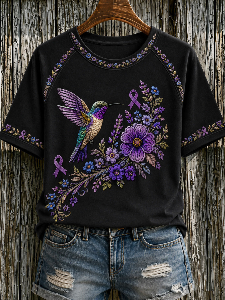 T-shirt för Alzheimers-medvetande med lila blommönster och kolibri, till stöd för drabbade kvinnor