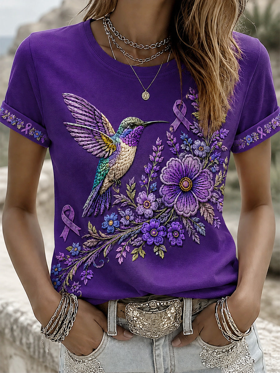 T-shirt för Alzheimers-medvetande med lila blommönster och kolibri, till stöd för drabbade kvinnor