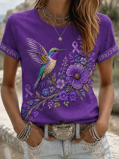 T-shirt för Alzheimers-medvetande med lila blommönster och kolibri, till stöd för drabbade kvinnor