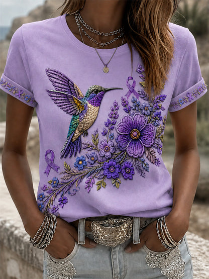 T-shirt för Alzheimers-medvetande med lila blommönster och kolibri, till stöd för drabbade kvinnor
