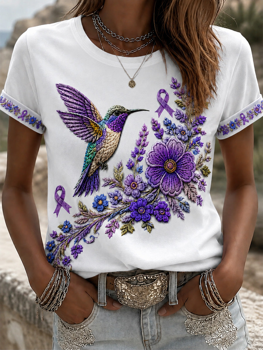 T-shirt för Alzheimers-medvetande med lila blommönster och kolibri, till stöd för drabbade kvinnor