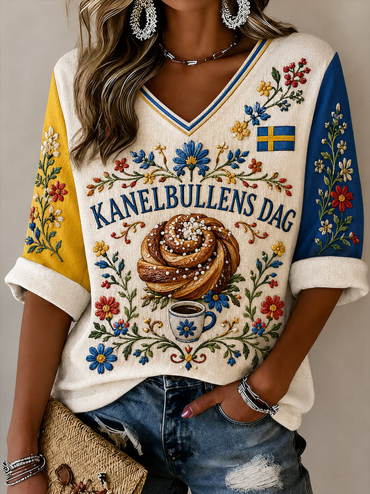 Dammössa Sverige Kanelbullens Dag-mönstrad linneskjorta med v-ringning