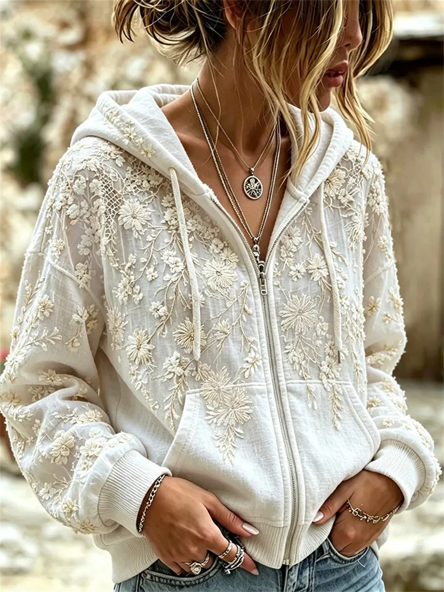 Damsvart, klassiskt boho-hoodie med vit blomsterkonsttryck och full dragkedja