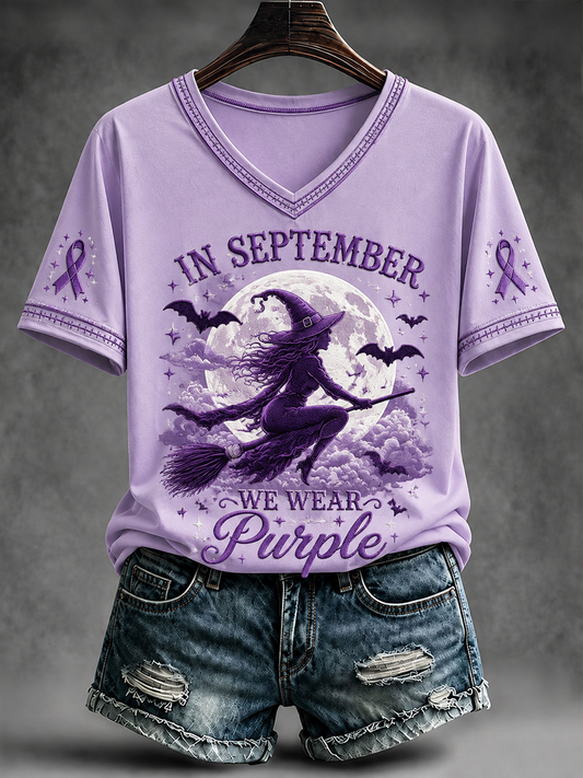 Kvinnors I september bär vi lila T-shirt med korta ärmarna