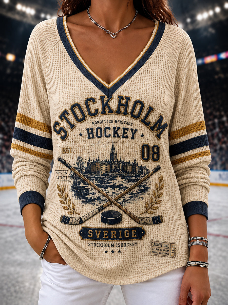 Damtröja i vintagestil från Stockholm, Sverige, med raglanärmar och ishockeymotiv