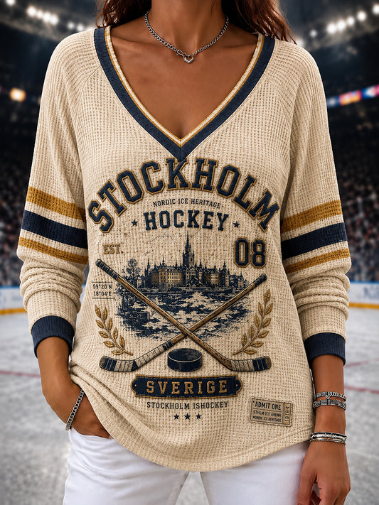 Damtröja i vintagestil från Stockholm, Sverige, med raglanärmar och ishockeymotiv